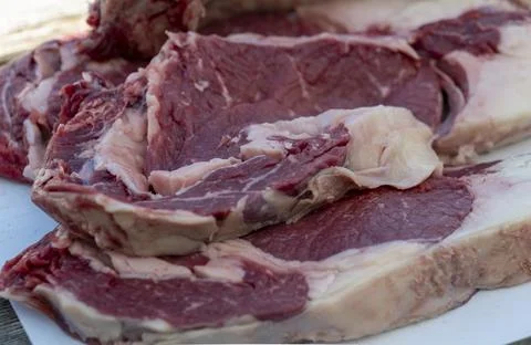 Selective focus of raw fresh steaks with an appetizing layer of fat Stock Photos