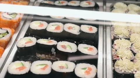 Selective focus on ready tasty sushi rolls standing on on the counter Stock Footage 222803521