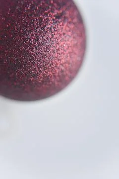 Selective focus at the red ball with glitters on the surface Stock Photos