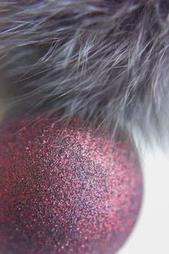 Selective focus at the red ball with glitters on the surface with the fur Stock Photos