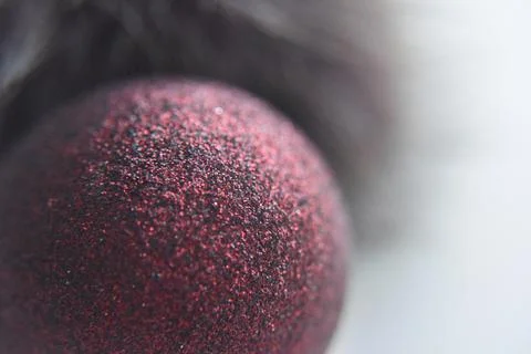 Selective focus at the red ball with glitters on the surface Stock Photos