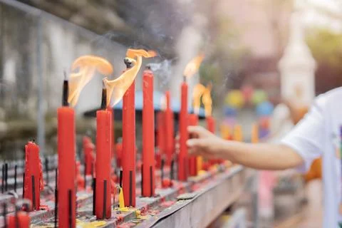 Selective focus of red candles are popular for paying respect to Buddha statu Stock Photos