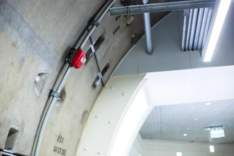 Selective focus to red fire alarm switch in the subway station. Stockfoto's