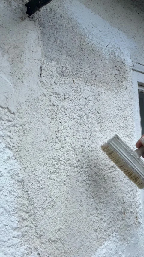 Selective focus renovation process of exterior wall coating Stock Footage 334329642