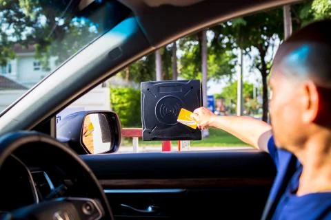 Selective focus to RFID reader with blur driver use key card to open the door Stock Photos