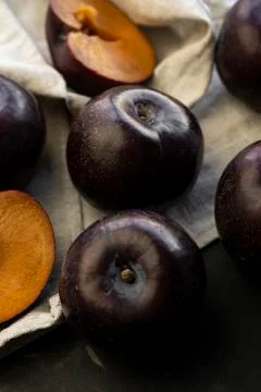Selective focus, ripe large dark plums Stock Photos