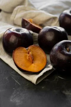 Selective focus, ripe large dark plums Stock Photos