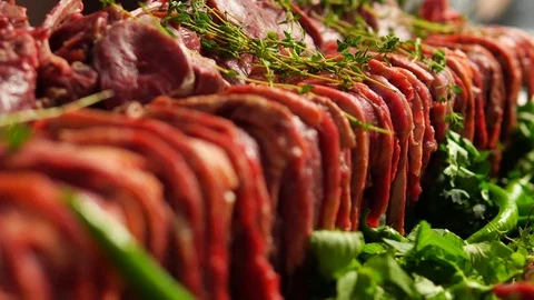 Selective focus, rows of raw red meat for a party. Rack focus. Video stock 109092154