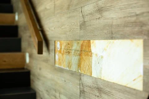 Selective focus to rubber wall tile damaged at wall. Stock Photos