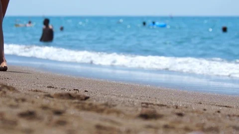 Selective focus. Sandy beach, defocused people. Video stock 91719707