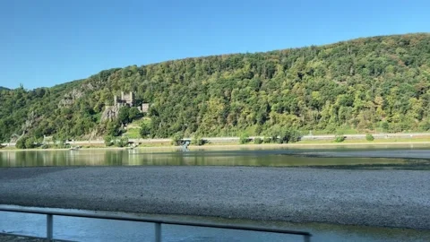 Selective focus scenic Rhine Valley river surrounded by forested mountains Stock Footage 345593107