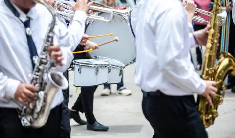 Selective focus to School Marching Band Playing Alto Saxophone and Trumpets.. Stock Photos