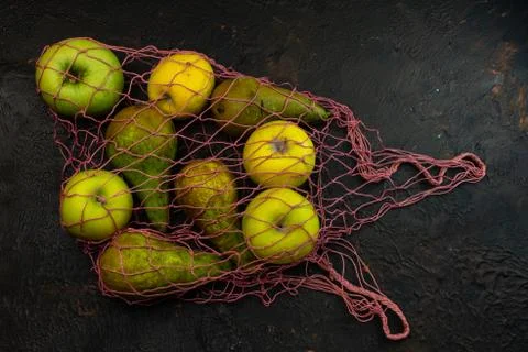 Selective focus, seasonal fruit in a string bag Stock Photos