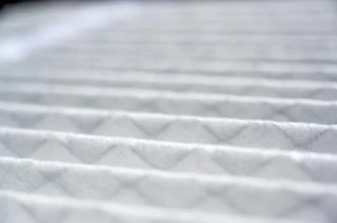 Selective focus on section of a new white and clean residential air filter Stock Photos