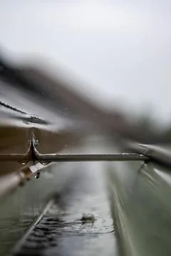 Selective focus on a section of residential guttering with hanger conveying Stock Photos