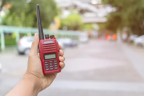 Selective focus of the Security guard uses radio communication for facilitate Stock Photos