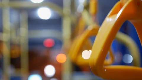 Selective focus of shaking pivoted grab handles on a moving shuttle bus Stock Footage 103551966