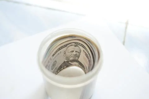 Selective focus shooting of US banknotes in a jar Foto stock