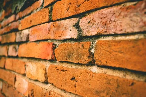 Selective focus shot the ancient brick wall background, old brick wall. Foto stock