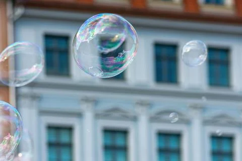 Selective focus shot of bubbles with a building background Stock Photos