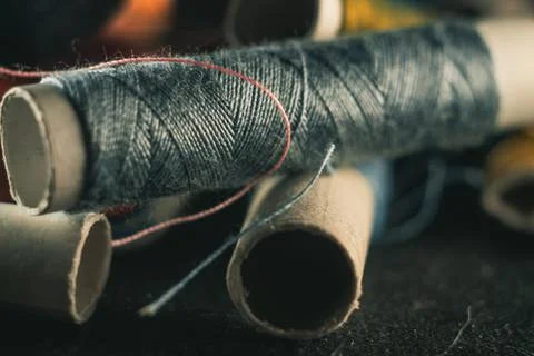 Selective focus shot of colorful thread stocks piled one on another Stock Photos
