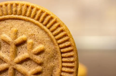A selective focus shot of a delicious ginger cookie with the pattern of a sno Stock Photos