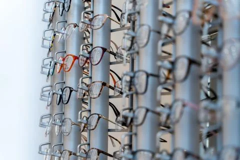 Selective focus shot of designer spectacles or glasses frames on display in an o Stock Photos