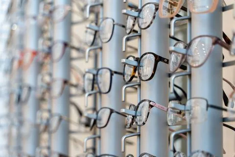 Selective focus shot of designer spectacles or glasses frames on display in an o Stock Photos