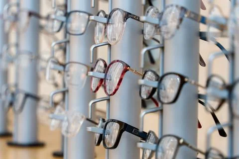 Selective focus shot of designer spectacles or glasses frames on display in an o Stock Photos