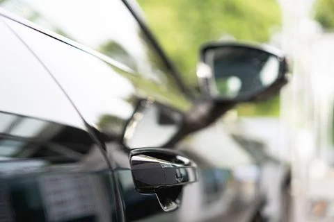 Selective focus shot of a door handle of a black car Photos