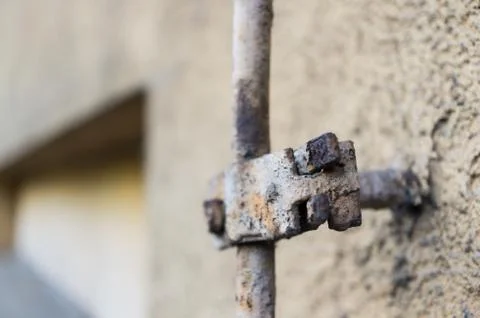 Selective focus shot of an old cable attached to a wall Stock Photos