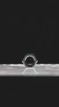 Selective focus shot of stainless hex nut on the top of an array of LED's Stock Photos