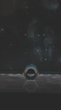Selective focus shot of stainless hex nut on the top of an array of LED's Stock Photos