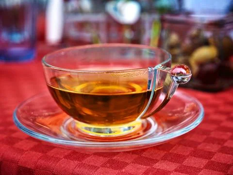Selective focus shot of tea in a transparent glass 스톡 사진