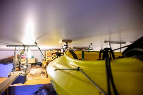 Selective focus on the side of a kayak that has used a Hoist and pulley system Stock Photos
