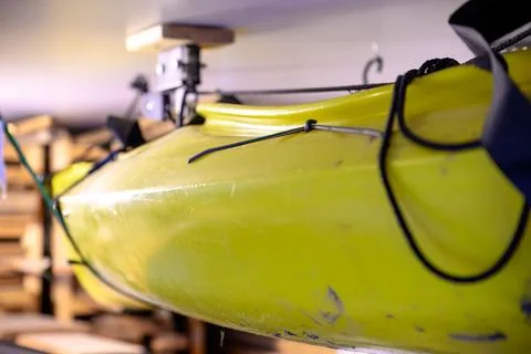 Selective focus on the side of a kayak that has used a Hoist and pulley system Stock Photos