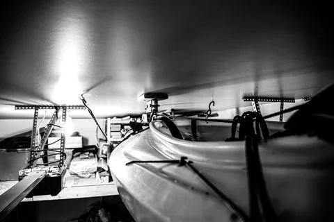 Selective focus on the side of a kayak that has used a Hoist and pulley system Stock Photos