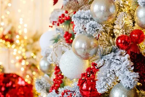 Selective focus. A side shot of a pine tree decorated with red and white Chri Stock Photos