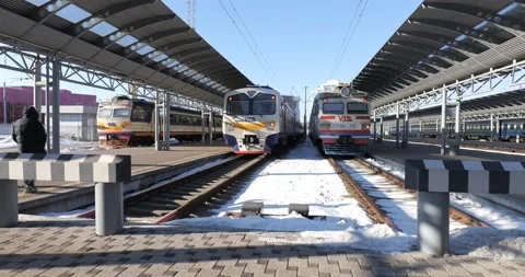 Selective focus at sidewalk of platform in railway station. Snowy day Stock Footage 222959855