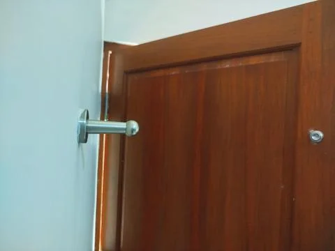 Selective focus a slightly dirty door stopper 스톡 사진