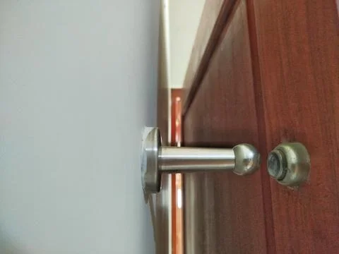 Selective focus a slightly dirty door stopper 스톡 사진