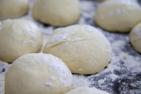 Selective focus on small and neat balls of air dough for baking sweet pies Stock Photos