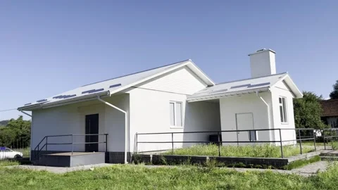Selective focus on small white house with boiler room attached Stock Footage 313713816