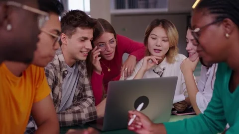 Selective focus on a smiling male young university student using laptop in the Stock Footage 260577293