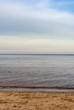 Selective focus, smooth horizon line, blue lake Stock Photos