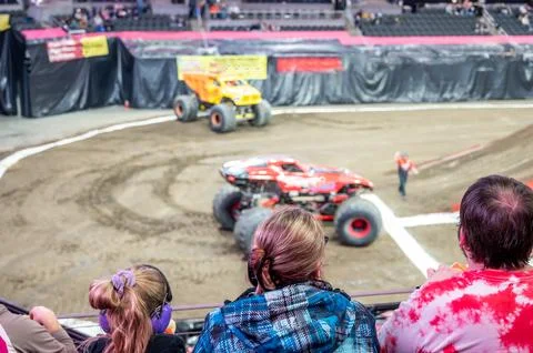 Selective focus on spectators in the stands with hearing protection watching a Foto stock