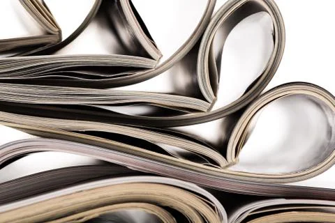 Selective focus of the stacking magazine place on white background Stock Photos