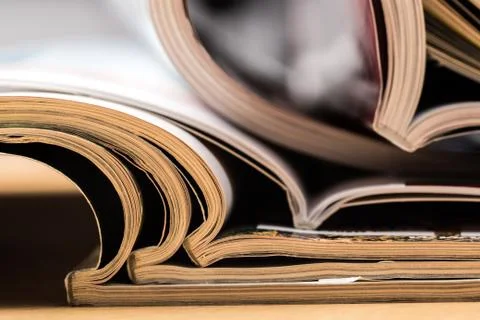 Selective focus of the stacking magazine place on white background Stock Photos