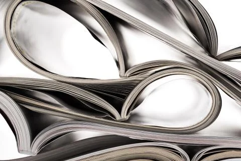 Selective focus of the stacking magazine place on white background Stock Photos