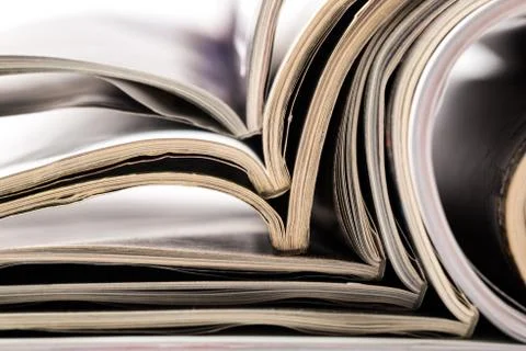 Selective focus of the stacking magazine place on white background Stock Photos
